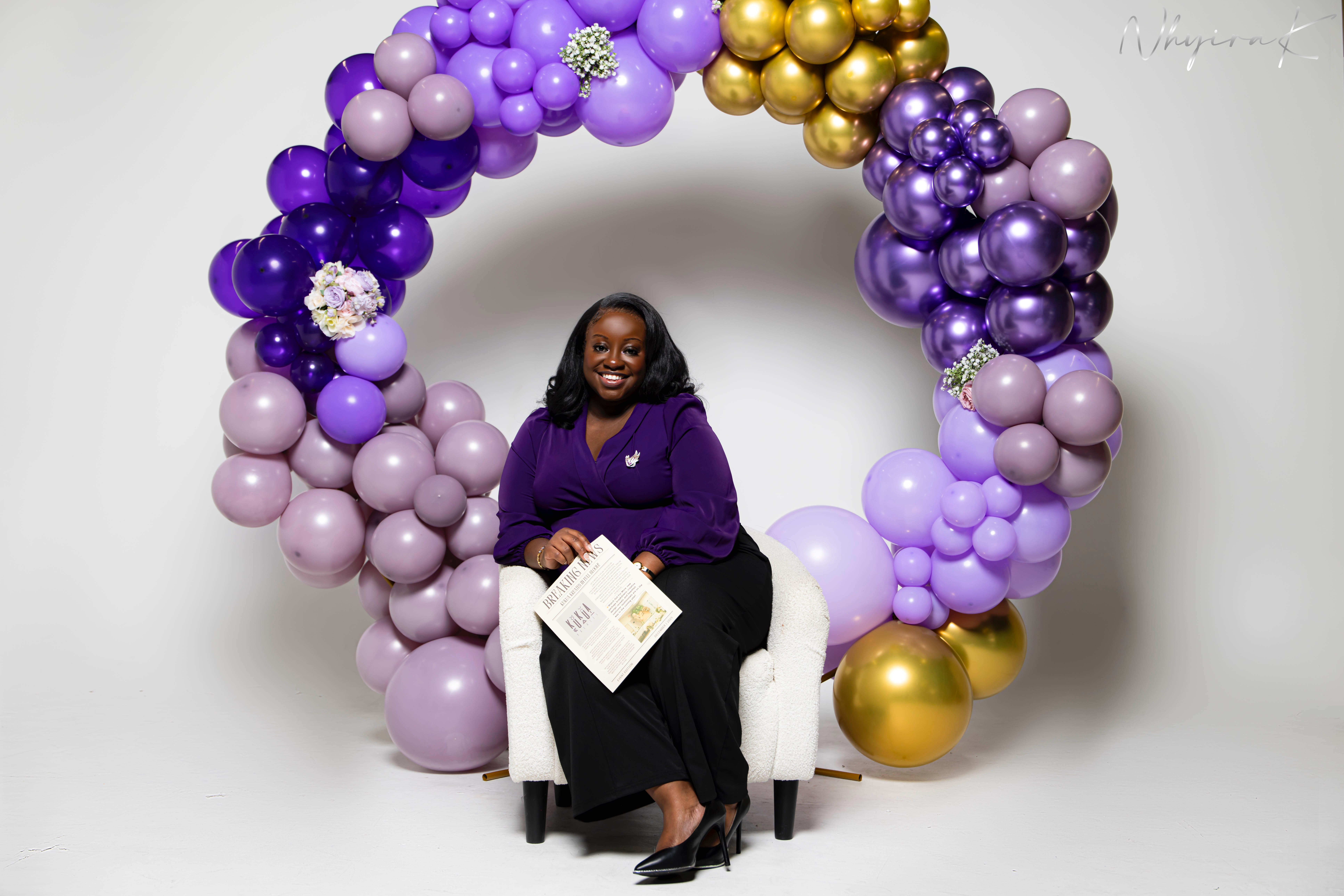 Floating candle centerpiece in a clear cylinder vase with soft green fabric runner.